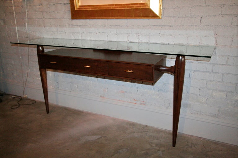 Beautiful Brazilian console table from the 1960s by Giuseppe Scapinelli with glass top and three drawers with brass pulls.

Measures: Base length 59