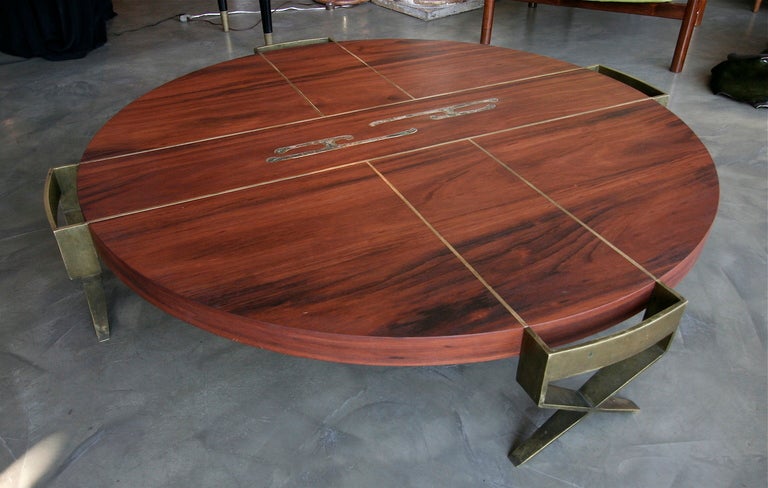 Extremely rare coffee table by Pepe Mendoza from the 1950s, made of gonçalo alves wood inlaid with brass and mother-of-pearl<br />
