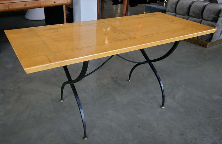 Beautiful dining table by Arturo Pani with patterned parchment top and graceful  legs with brass details.