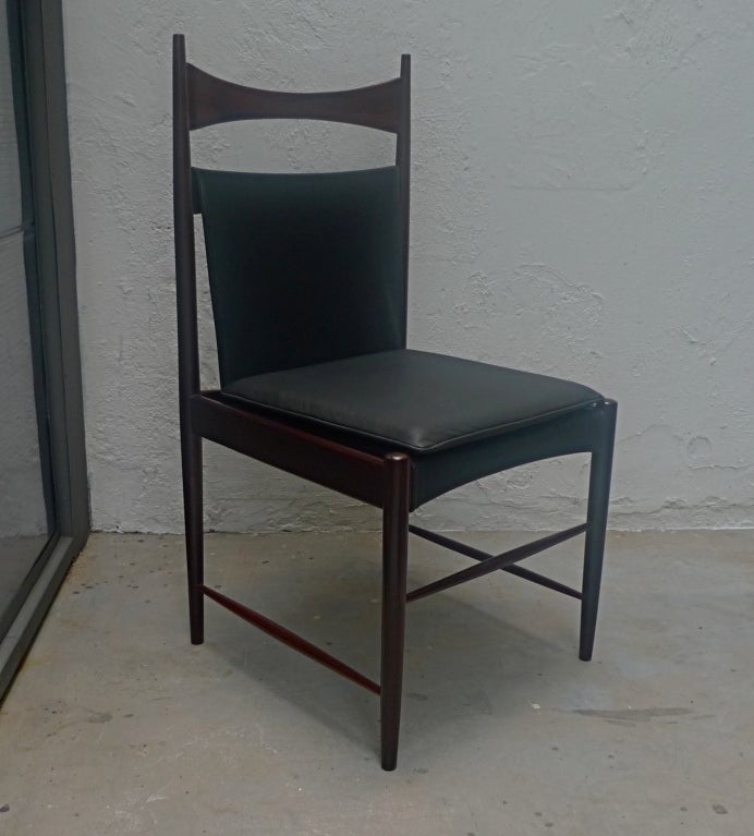 Set of eight high-back jacaranda chairs upholstered in leather, designed by Sergio Rodrigues in 1959.

Please call or use the contact dealer link below to reach us directly with any questions regarding this item. We are happy to obtain delivery