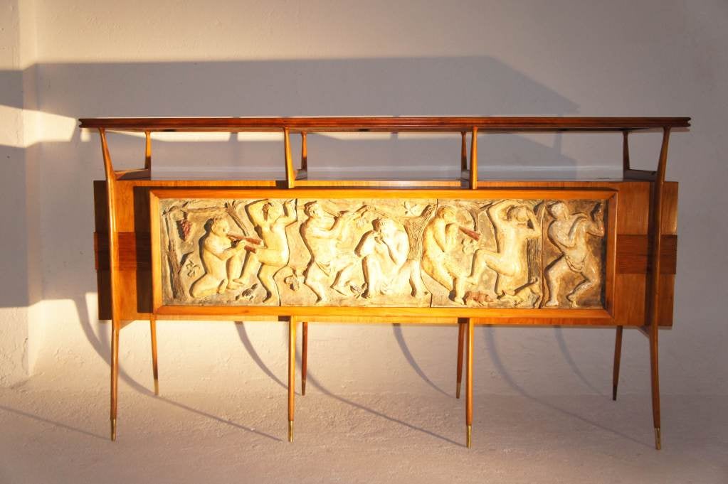 Extremely rare 60's Brazilian caviuna wood bar with three stools, adorned by a ceramic sculpture designed and made by Scapinelli