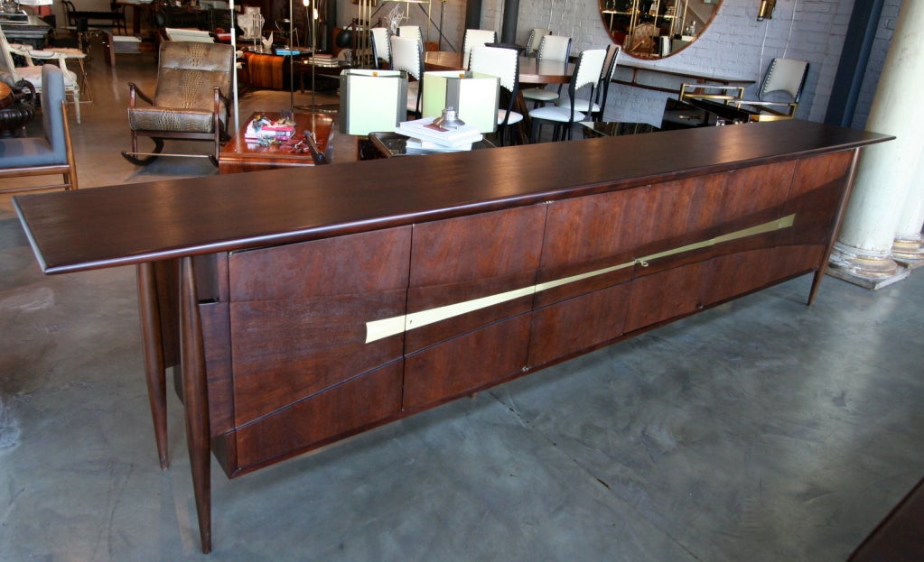 50's dining room credenza with three compartments and six doors. The credenza forms a set with the dining room table Ref. #U12060281751076 and ten dining room chairs Ref. #U12060281751078, but can be sold separately from the table and the