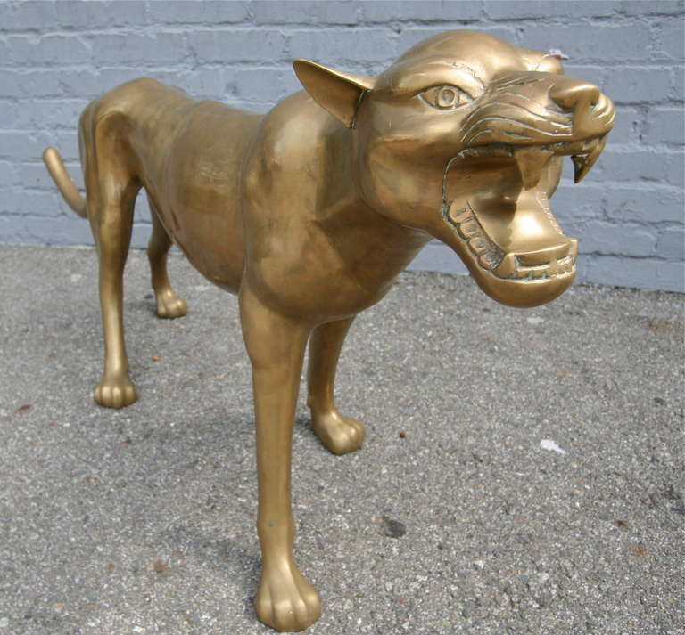 Brass floor sculpture of a cougar from the 1960s
