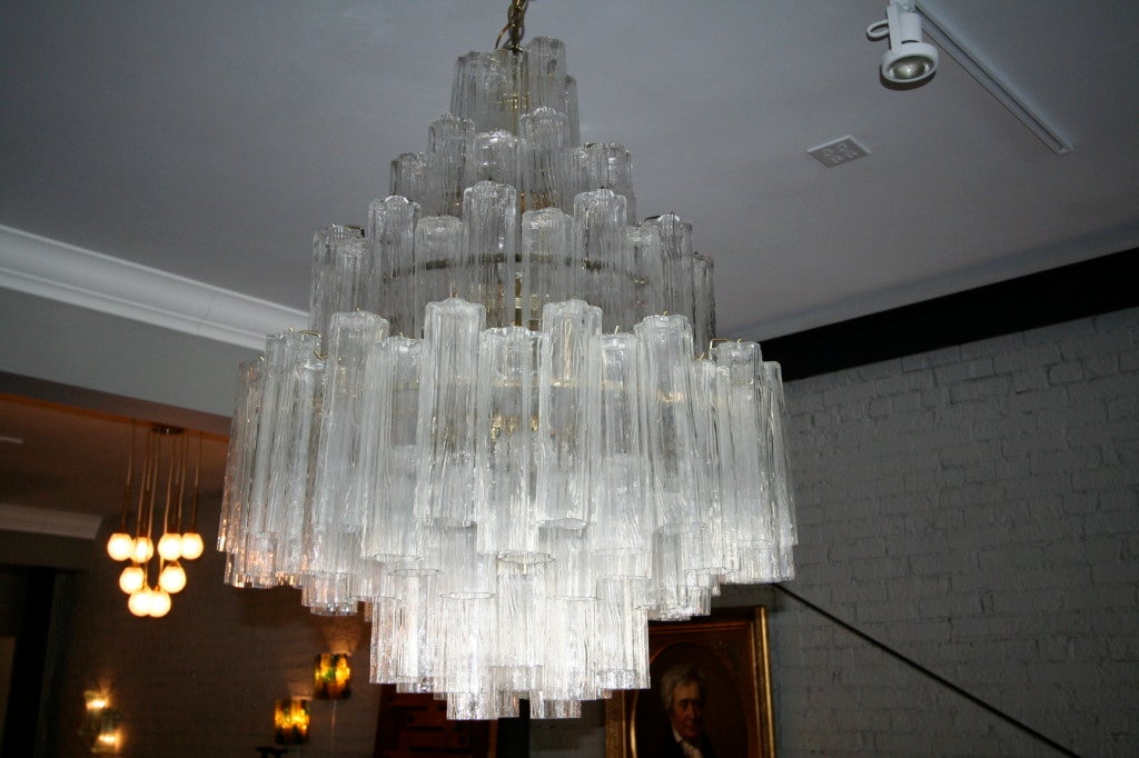 Seven-tiered chandelier designed by Venini in the 1960's. The Murano glass fixture has 120 five lobed 