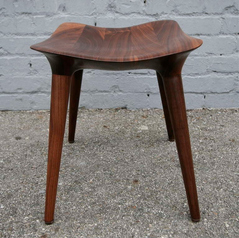 Wooden stools by Bryan Drinchich, handcrafted with an oil and wax finish.  Two are made of mahogany, the other of sapele.
