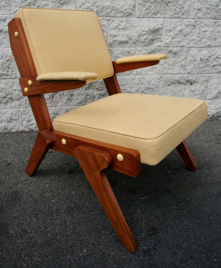 Pair of chairs by Lina Bo Bardi upholstered in beige leather.
