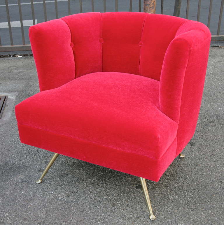 A pair of 1960s Italian lounge chairs with brass legs, upholstered in red silk mohair.