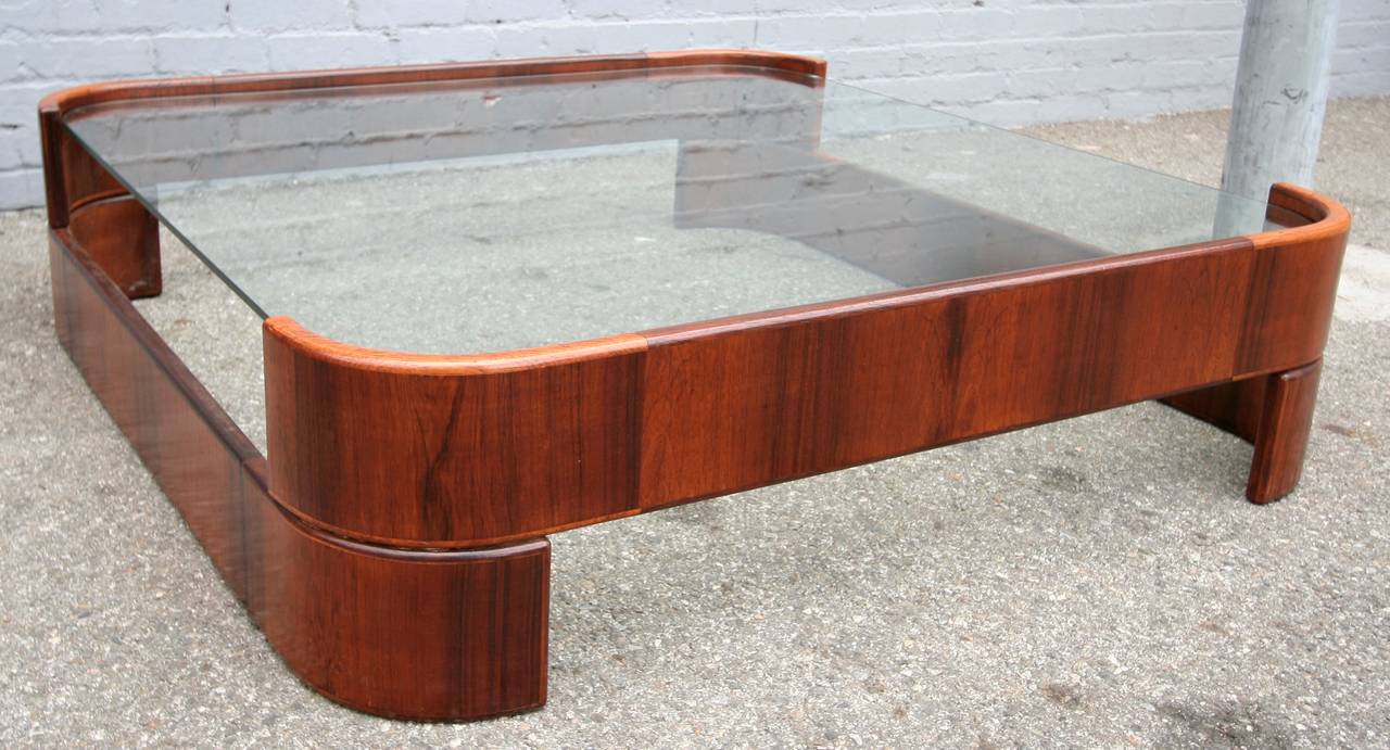 Brazilian jacaranda and glass coffee table by Novo Rumo from the 1960s.