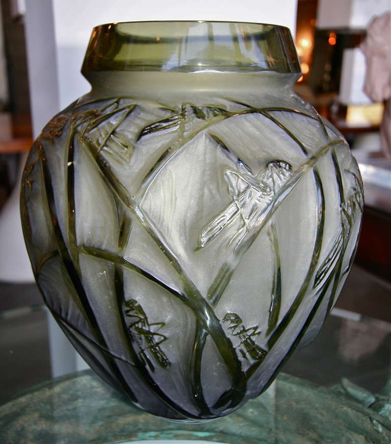 Rene Lalique Sauterelles grasshopper vase from the 1930s in green glass.