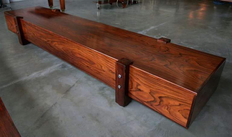 Long Eleh bench by Sergio Rodrigues in beautifully grained jacaranda wood

Please use the contact dealer link below to reach us directly with any questions regarding this item. We are happy to obtain delivery quotes from our network of insured