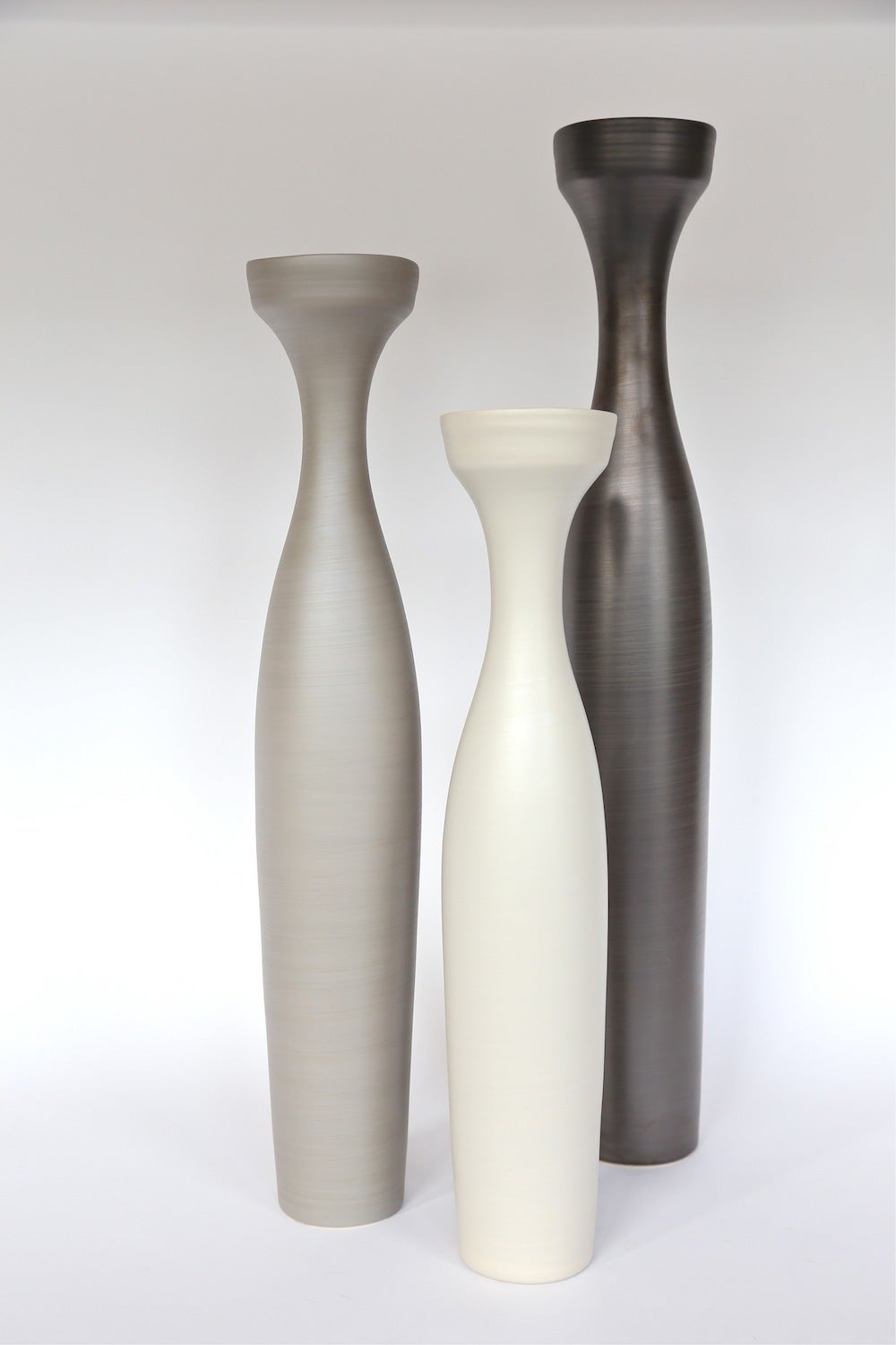 Italian handmade ceramic vases in linen, dark bronze and light brown by Rina Menardi. Available in different colors. Priced individually.

Measures: Small $745 (Diameter 4.25