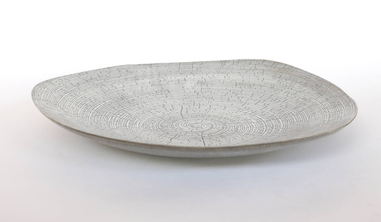 Italian handmade ceramic plates or platters in crackled sand and birch by Rina Menardi. Priced individually. Available in other colors.  Sand color no longer available.  Made to order.  Shipping from Europe not included.

Measures: Medium sand $595