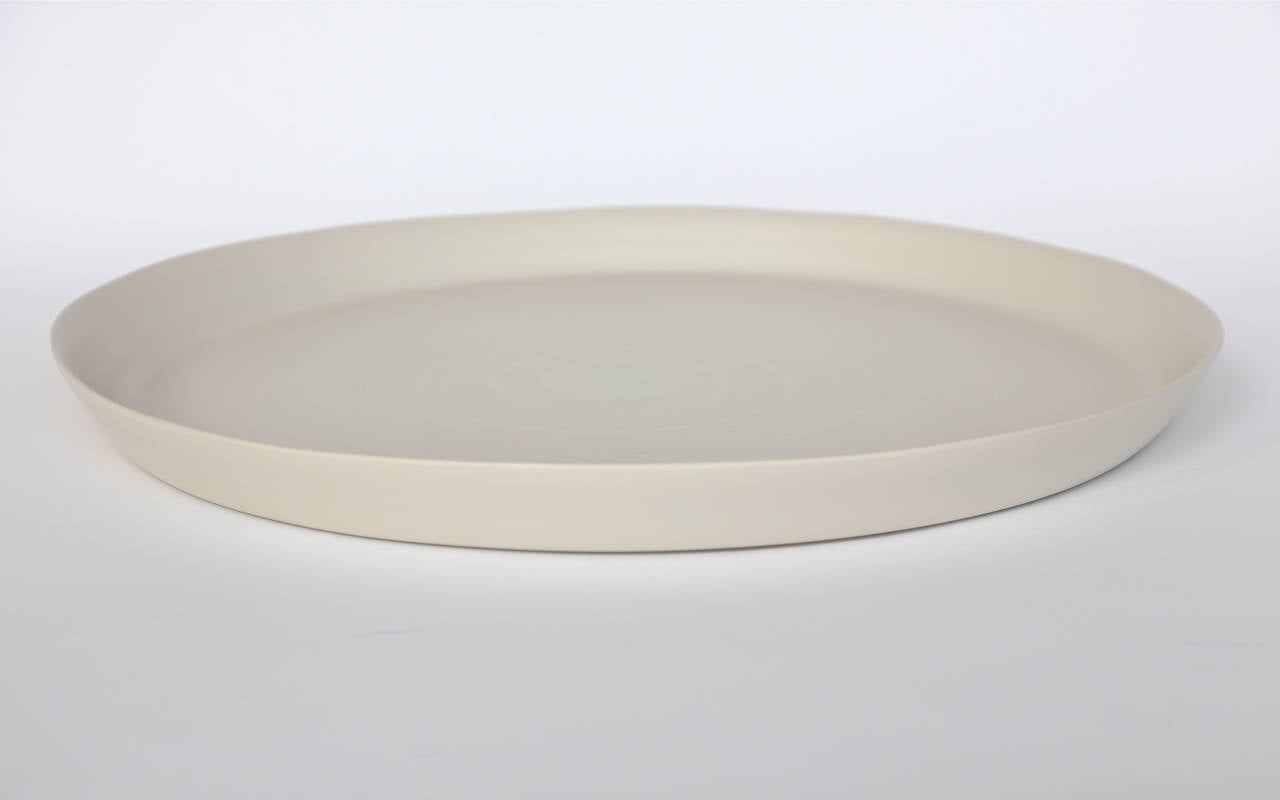 Italian handmade ceramic bowls, plates and tableware in linen, bronze, light brown and white by Rina Menardi. Priced individually not as a set.

Dimensions and prices:
Maxi tray $935 - (Diameter 29