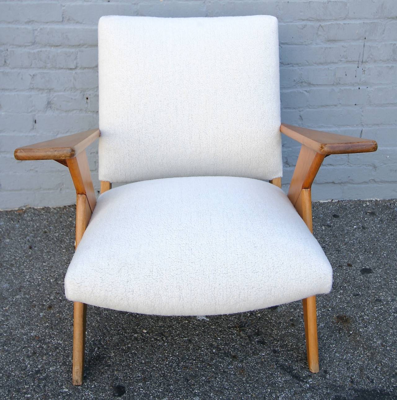 Zanine Brazilian armchair in imbuia wood upholstered in faux shearling.