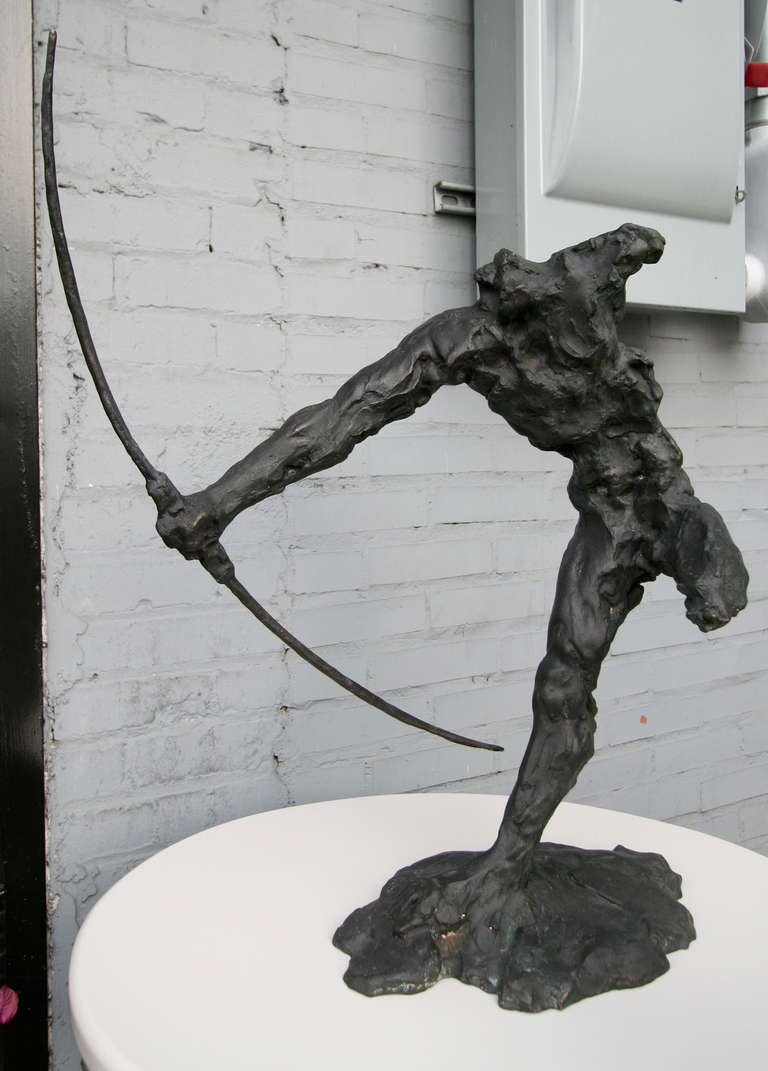 Bronze sculpture of an archer by Zoran Males.

Born in Belgrade in 1962, Zoran Males concentrated his studies in sculpture, though he also designs furniture. He works in bronze, stone and wood to create his pieces.