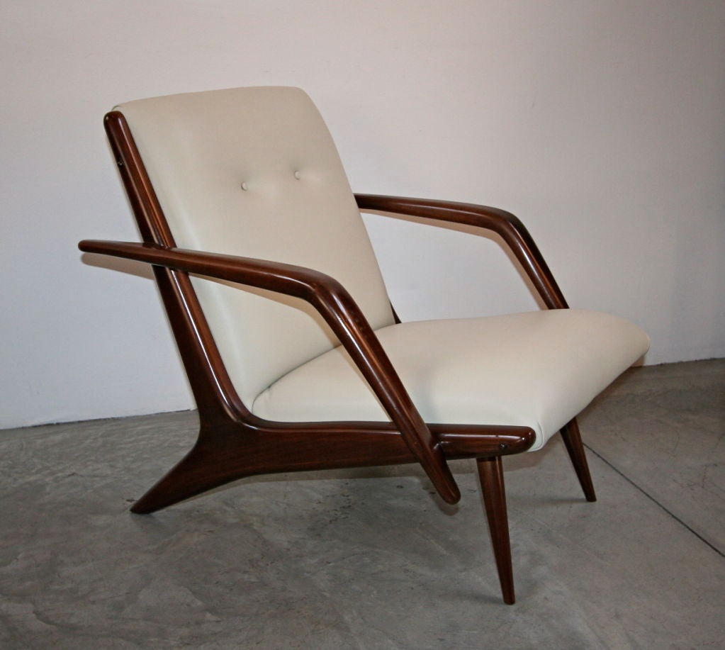 Pair of 60's Brazilian caviuna armchairs by Scapinelli, upholstered in beige leather