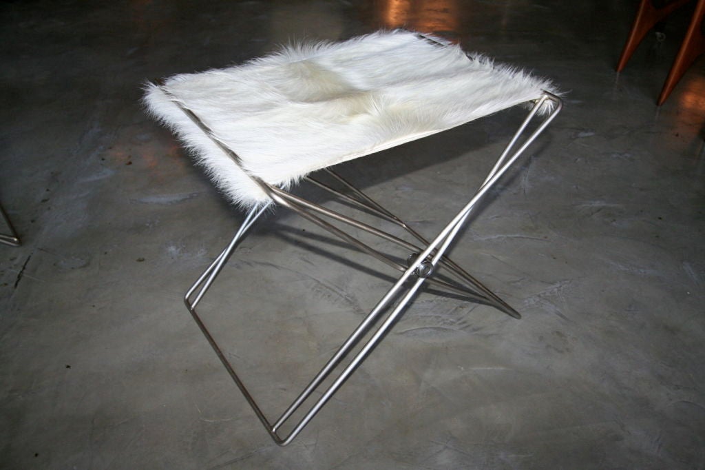 Pair of 1970s nickel folding stools upholstered with cow hide, in the style of Jorgen Gammelgaard.