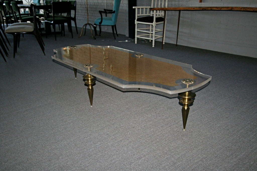 60's Lucite Coffee Table with Sculptural Brass Legs
