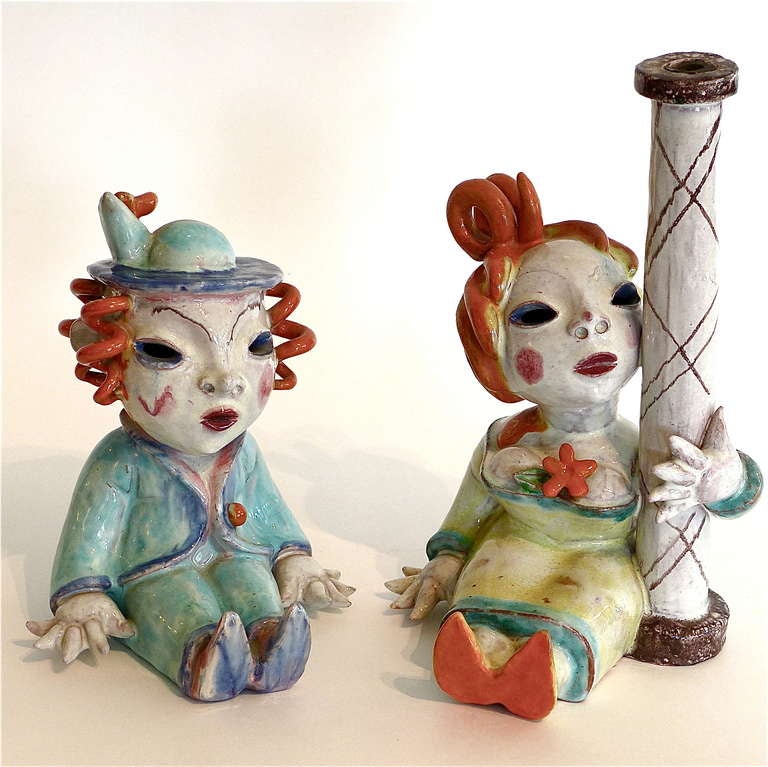 The female figure was designed to be wired as a Lamp and has a wire way at the base of the column. This rare couple is in excellent condition.