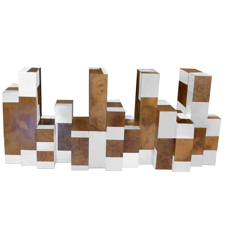 This ultimate Cityscape table brings to mind a downtown skyline. The sculptural table base supports a 3/4