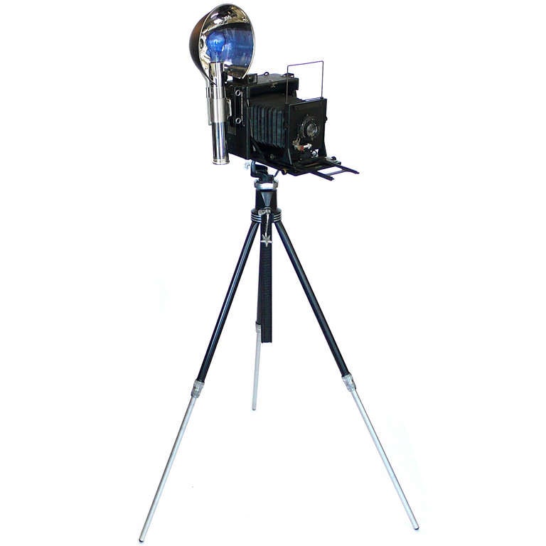 This pre-war Speed Graflex comes with an original fully adjustible Star Tripod. All parts fold for easy shipping. Makes a great display item.