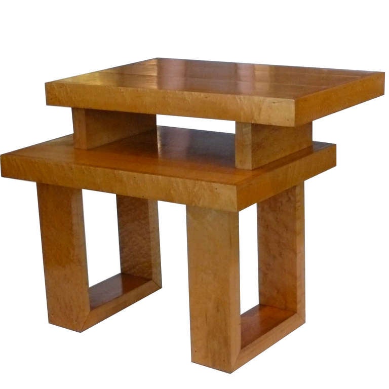 This amazing pair of tables were handmade of solid maple by a Northern California furniture craftsman in the 1940's. The unique asymetrical design references the strong De Stijl influence.They retain their original finish and patina. We have the