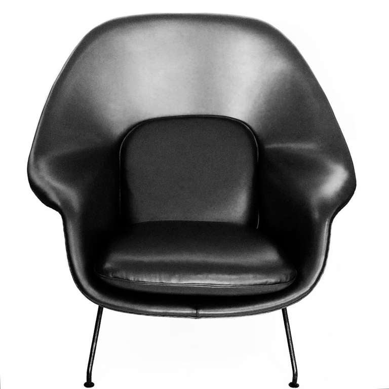 This iconic early Womb chair has been expertly restored. The black top of the line leather is hand stitched and the old foam has been replaced. The black finish is in excellent original. The chair has the early one piece feet that are a formed part