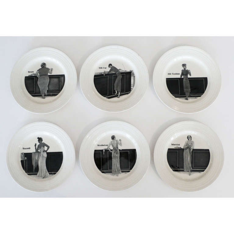 These whimiscal and very humorous plates are a complete set from the 1930's. They show a different woman on each plate standing in front of an Art Deco bar. Each repesenting six of the most popular drinks of the day.