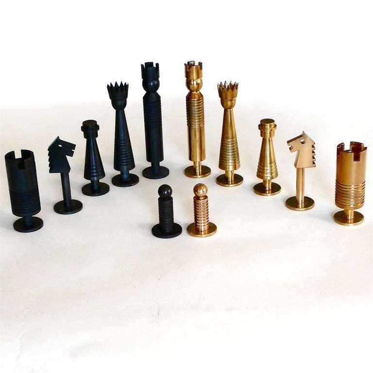 These great chess pieces are made of brass and patinated brass. They come with an inlaid wood box with fitted compartments that also serves as the chess board.