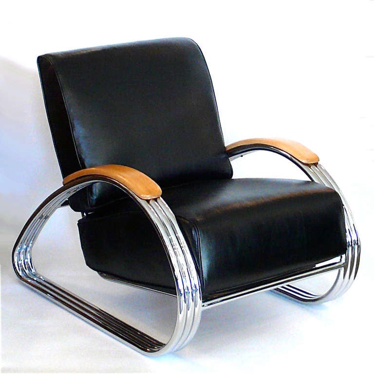 This beautifully restored icon of American design was designed by KEM Weber for Lloyd's Manufacturing in the 1930's. It is upholstered in black leather. Besides being the epitome of American streamline design, it is one of the most comfortable