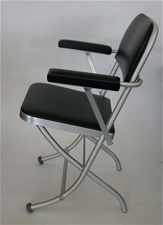 This is a great set of McArthur folding chairs manufactured by Mayfair. Each chair has it's original black upholstery which is is excellent condition. This stylish design has it's original rubber donut feet. They are comfortable and don't feel like