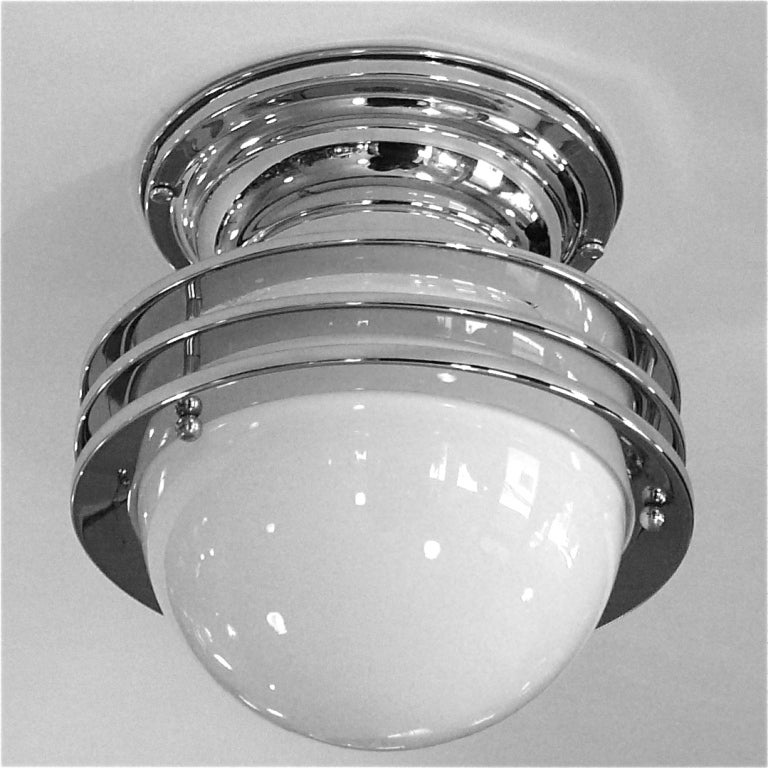 This great small ceiling fixture is beautifully designed. The three saturn rings are fitted around the glass globe and the unit can be positioned at various angles, straight ot tilted around the globe.