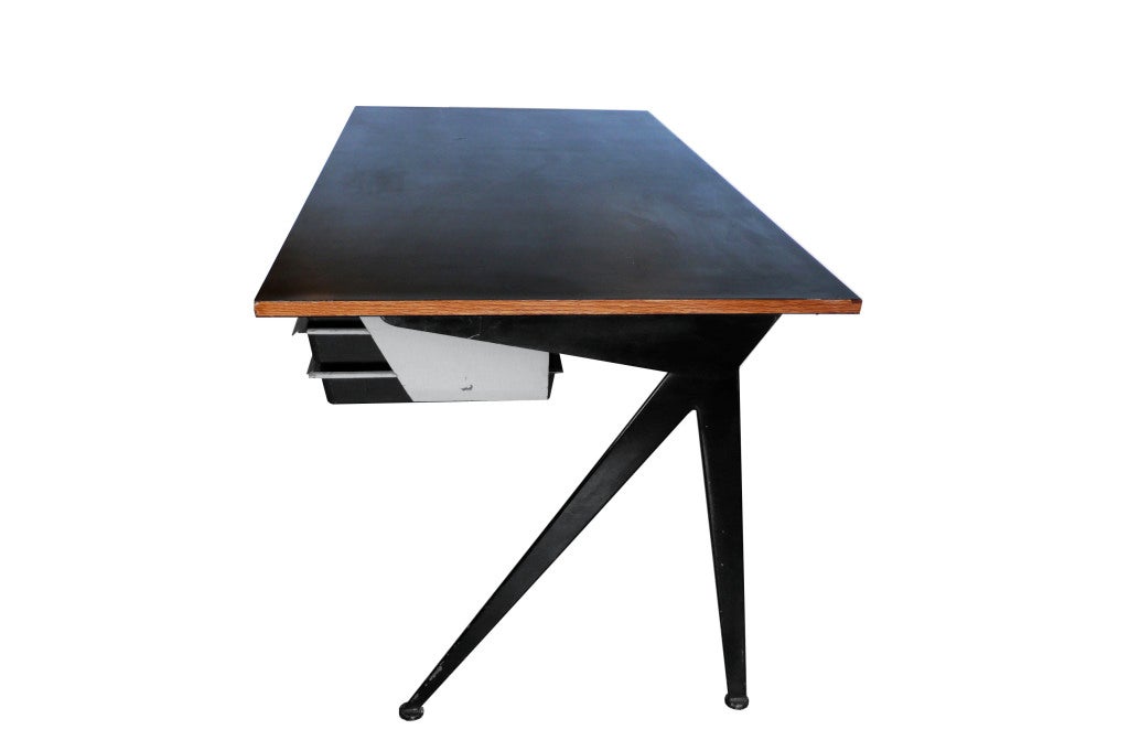 This is the rare, large version of the classic Prouve compass desk. It is completely original and retains it's original molded plastic drawer inserts.