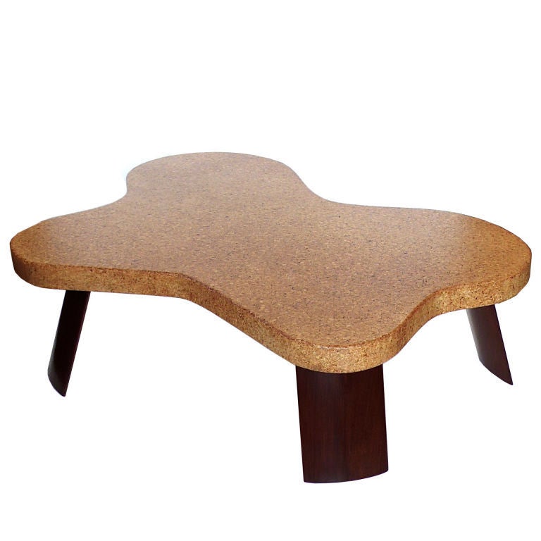 This is an amazing example of an original Paul Frankl amoeba shaped table. It retains it's original natural cork top with no chips, staining or discoloration. It is gorgeous.