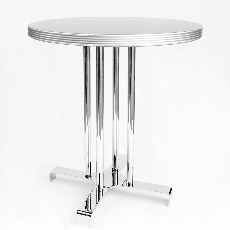 Excellent pair of Streamline Moderne restored chrome side tables designed by Lloyd's Manufacturing circa mid 1930's.