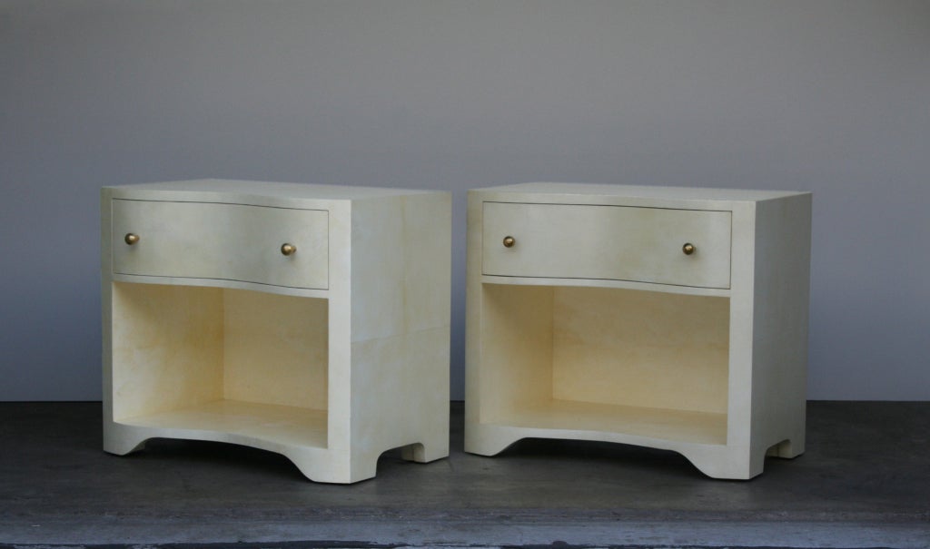 Parchment nightstand in bleached finish and with brass handles, Serpentine style. By order.