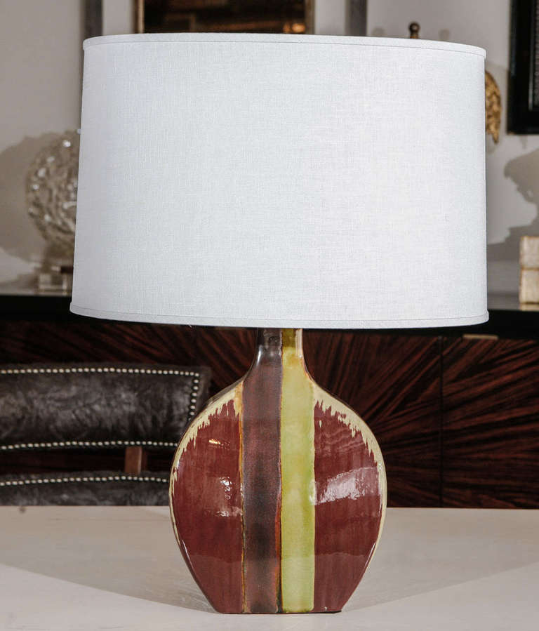 Pair of multi-color, hand painted glazed ceramic table lamps.