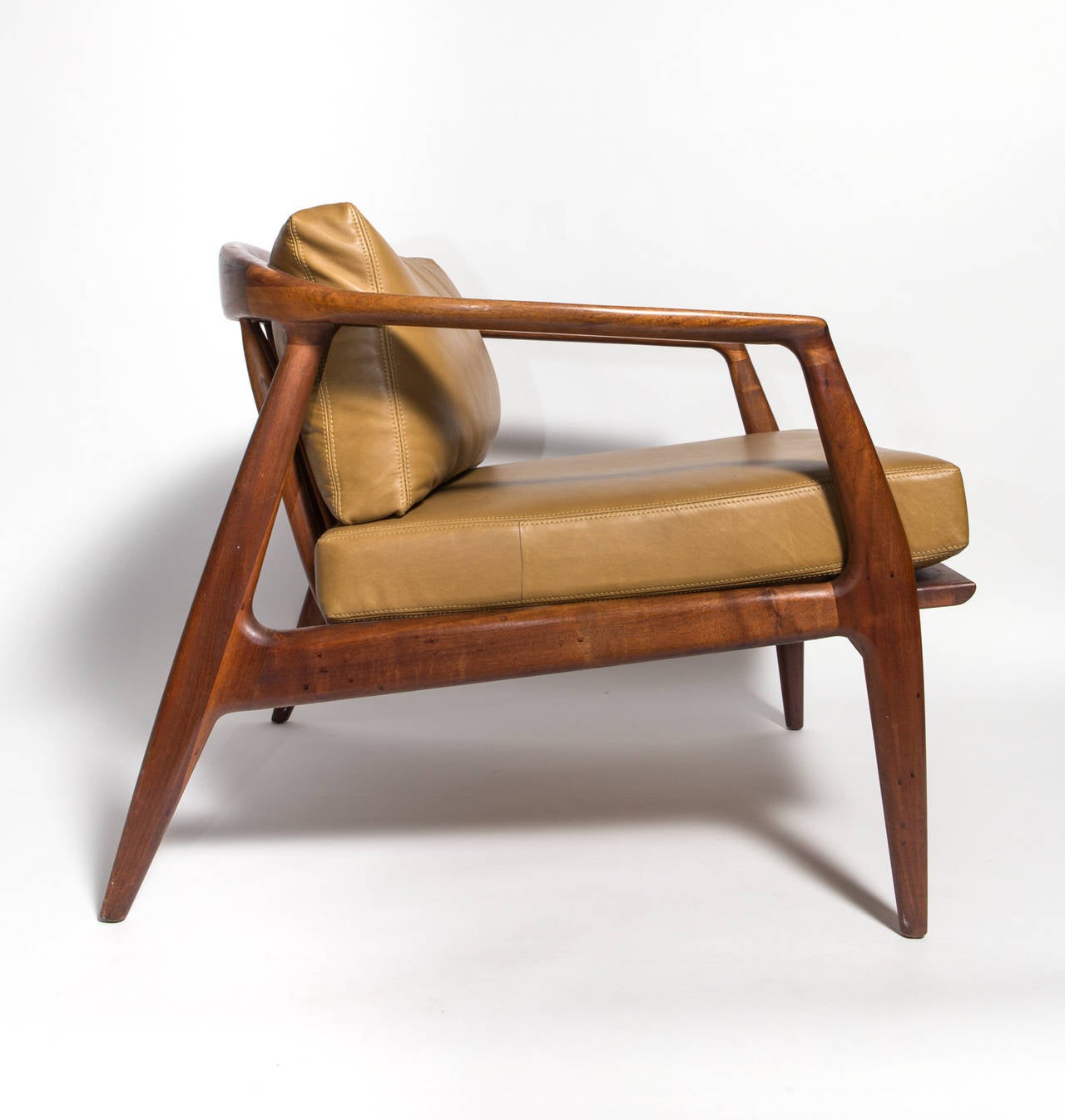 Milo Baughman leather and walnut lounge chair, 1960s, manufactured by Thayer Coggin. Leather color is a mustard tone with double stitching.