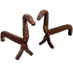 A Pair of Continental Rustic Metal Andirons