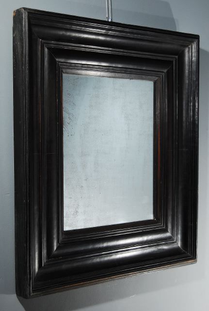 A Spanish Baroque Style Ebonized Molded Mirror