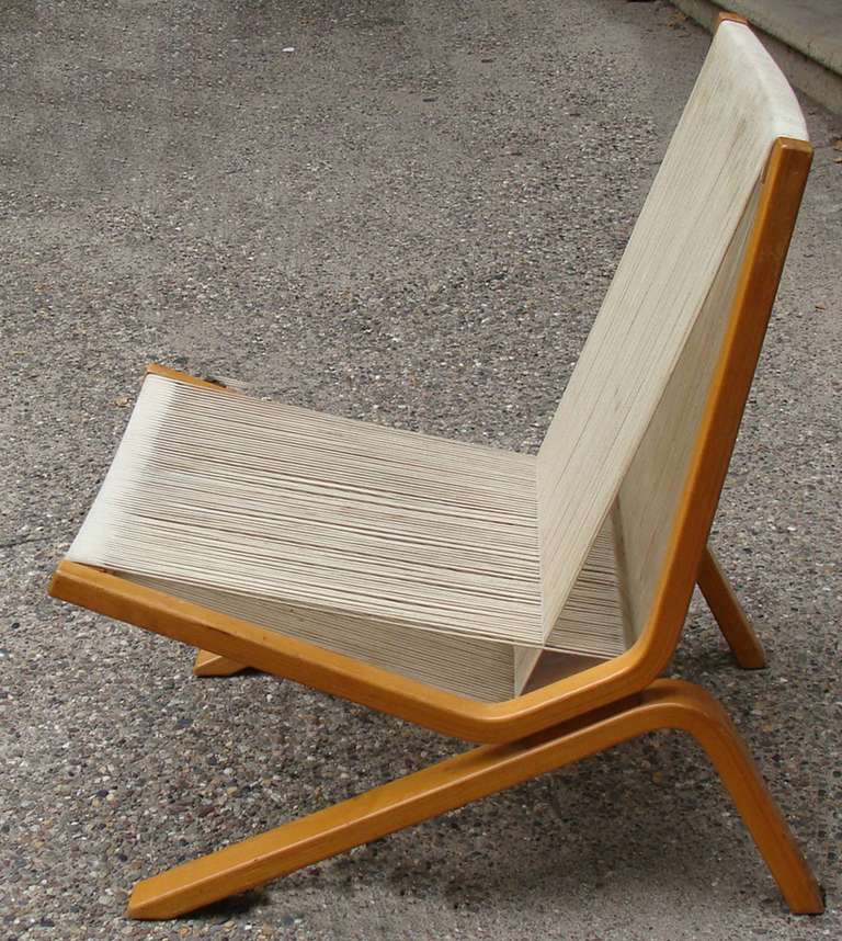 Assembled pair of the low string chair designed by Allan Gould for Functional Furniture, New York City c. 1947 - 49.

Laminated birchwood frame and string/cord.  Unrestored finish and cord 