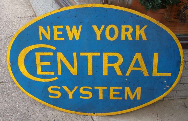 Industrial/Folk Art Quality.  Large oval sign for New York Central Railroad.  Blue paint on galvanized steel.
Gold painted lettering and border are applied.  Minor dings and scratches.
