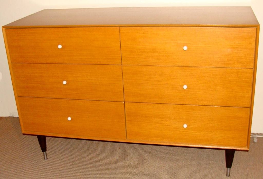 Fine mid-century dresser in bleached mahogany.  Ebonized legs in wood and metal. Although the specific designer of this item is unknown, Mengel has manufactured furniture designed by Raymond Loewy and the architect Morris Sanders.<br />
<br