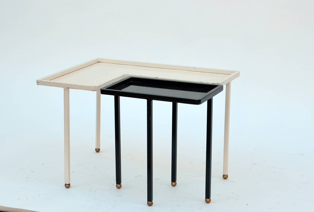 Small Black and White Lacquered Metal Side Table in the style of Mathieu Matégot. Brass accents.

Smaller black table: 12
