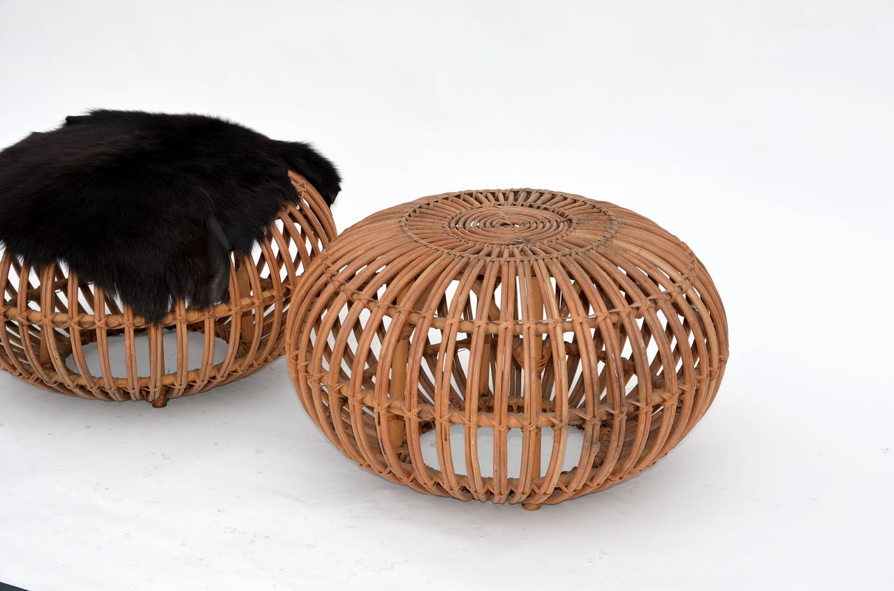 Pair of Round Rattan Ottomans in the Style of Franco Albini with Fur Covers In Good Condition In Los Angeles, CA