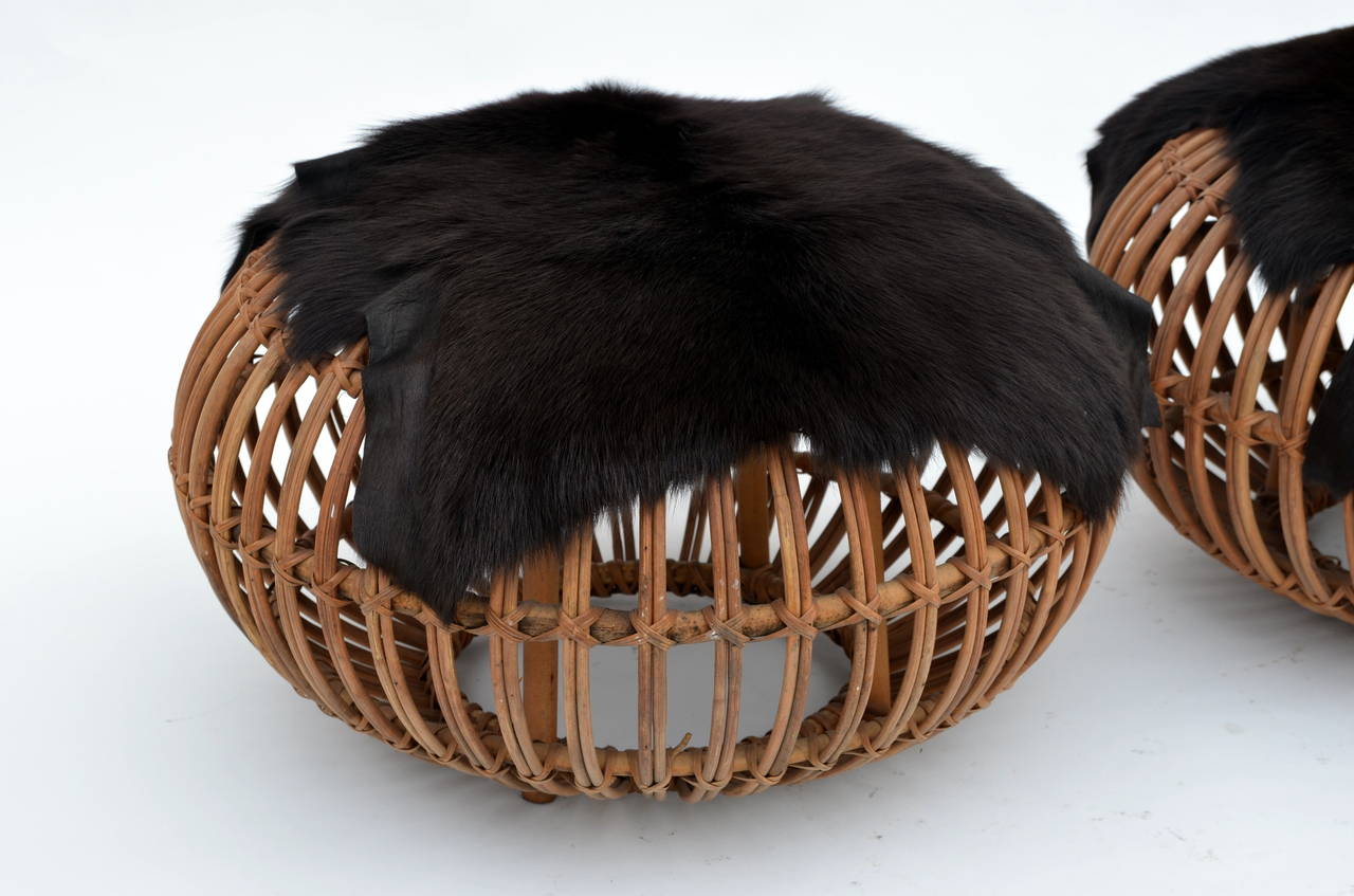 Pair of Round Rattan Ottomans in the Style of Franco Albini with Fur Covers 1