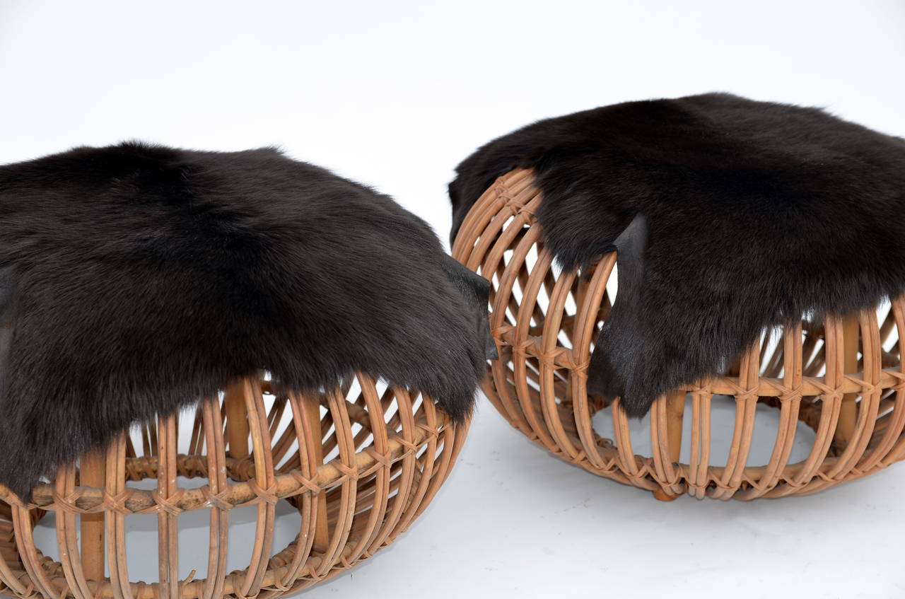 Pair of Round Rattan Ottomans in the Style of Franco Albini with Fur Covers 2