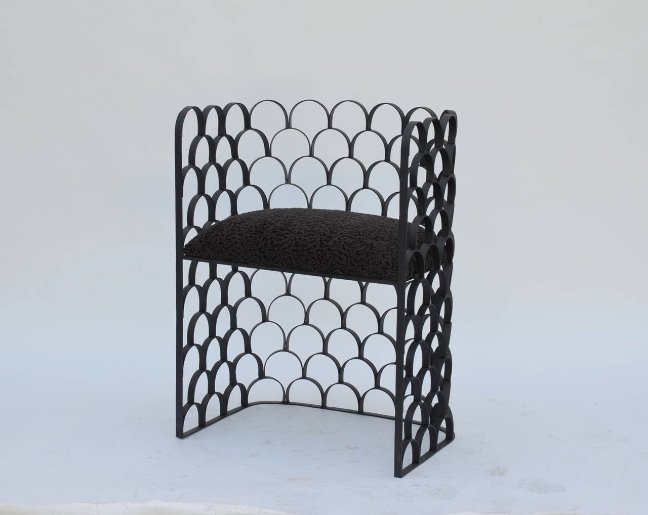 Sculptural 'Arcature' stool (or side chair) by Design Frères. Wrought iron base with Astrakhan wool seat. Pair available.