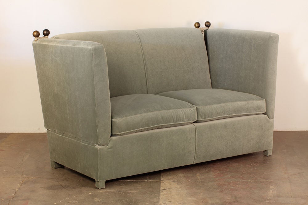 Chic blue grey velvet French 40's Knole style small sofa by Jansen. 20 in. seat height. Adjustable side arms.