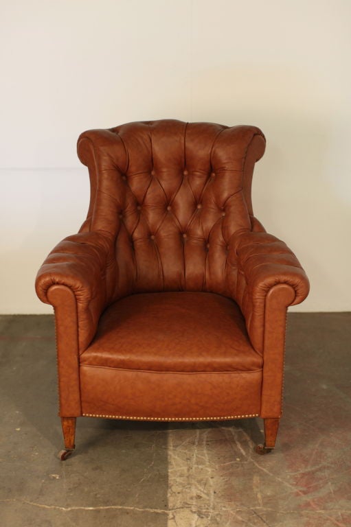 Chic large tufted leather Napoleon III bergere on casters. Very comfortable. A Classic look.